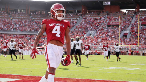 Oklahoma's Nic Anderson (4) scores touchdown in the first half of the college football game between the University of Oklahoma Sooners and the University of Central Florida Knights at Gaylord Family Oklahoma-Memorial Stadium in Norman, Okla., Saturday, Oct., 21, 2023.